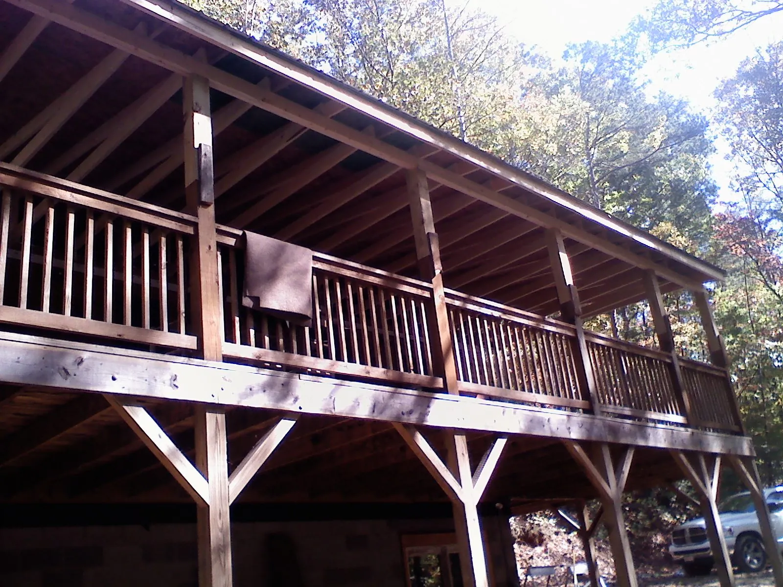 Timber framing under a new elevated porch and deck — Roof Leak Repair in Coats by Roofing Brothers